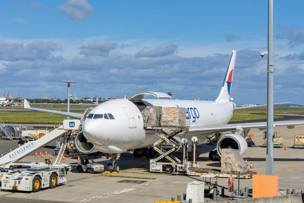 Cargo plane being loaded on an airport freight apron