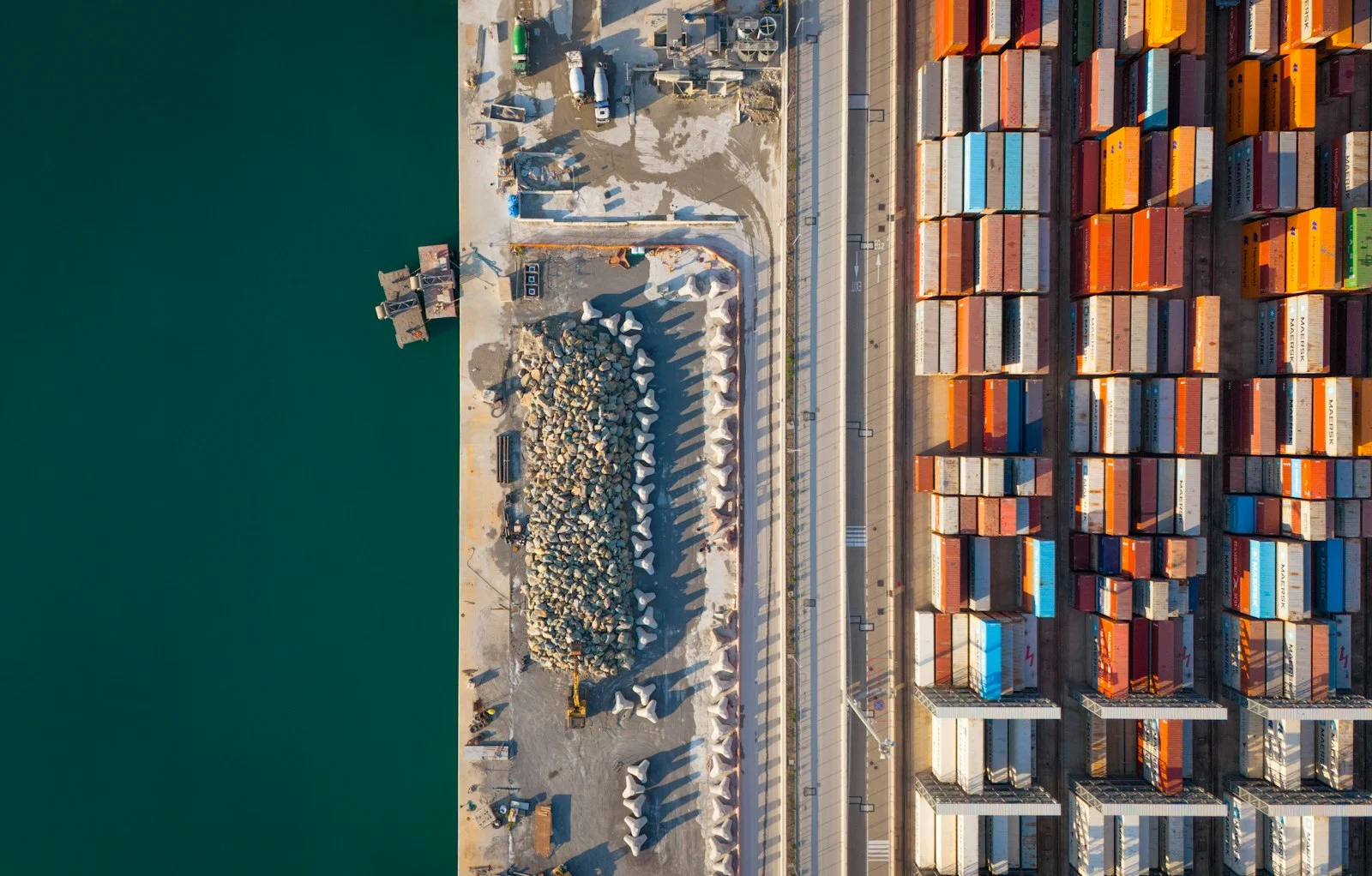 Aerial view of a busy port with colourful shipping containers