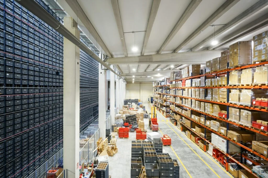 Large warehouse filled with stacks of cardboard boxes