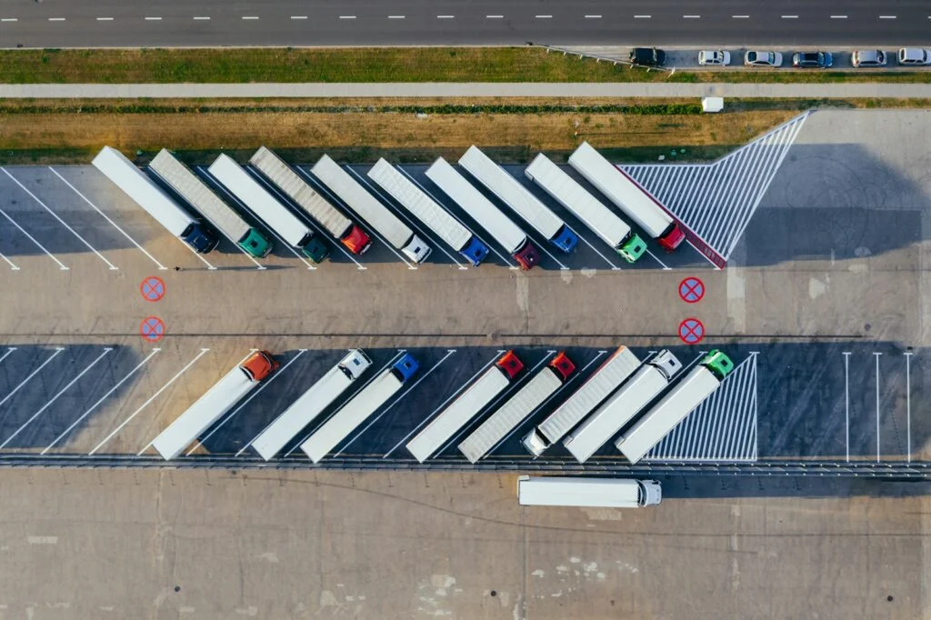 Rows of parked trucks in a logistics yard