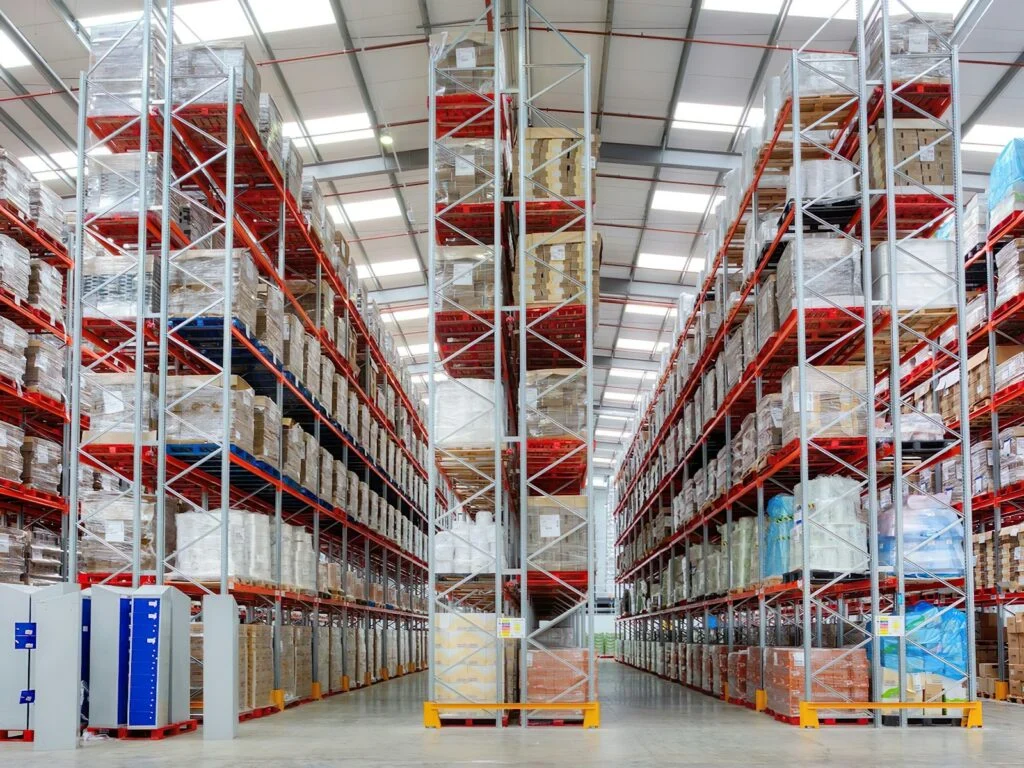 Large warehouse interior lined with tall storage racking